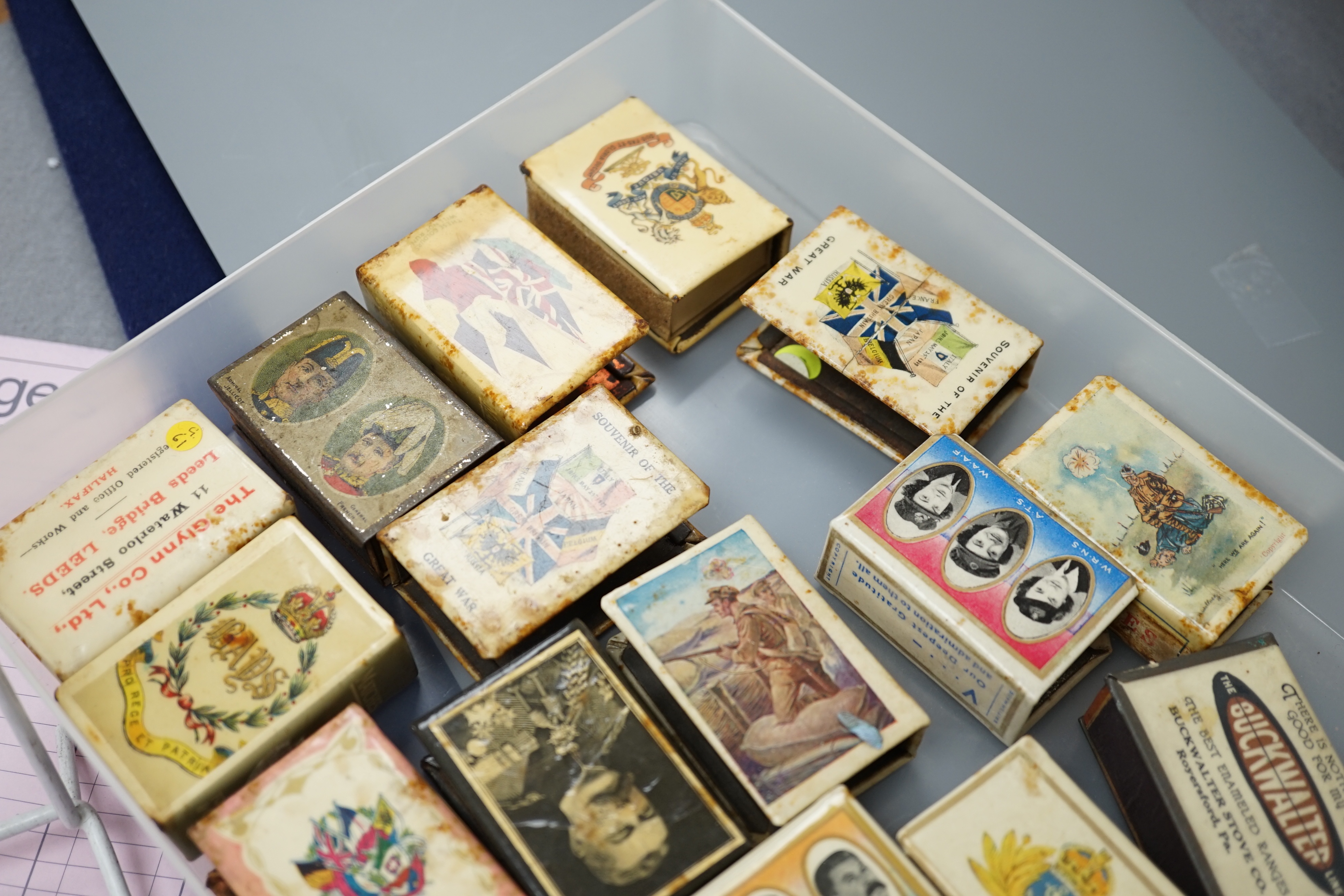 A collection of early and mid 20th century WWII match box holders